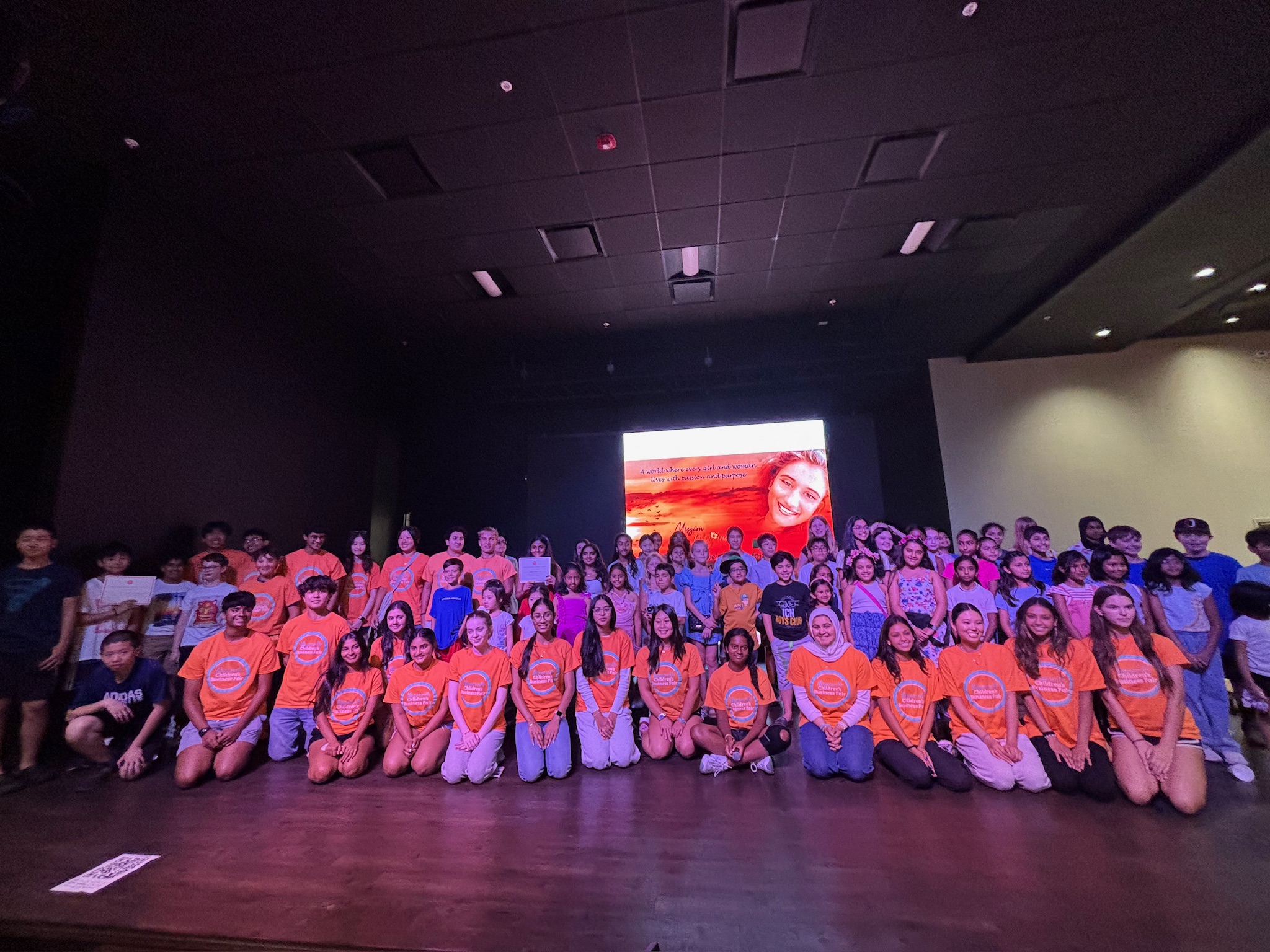 Young entrepreneurs smiling at the Naperville Children's Business Fair