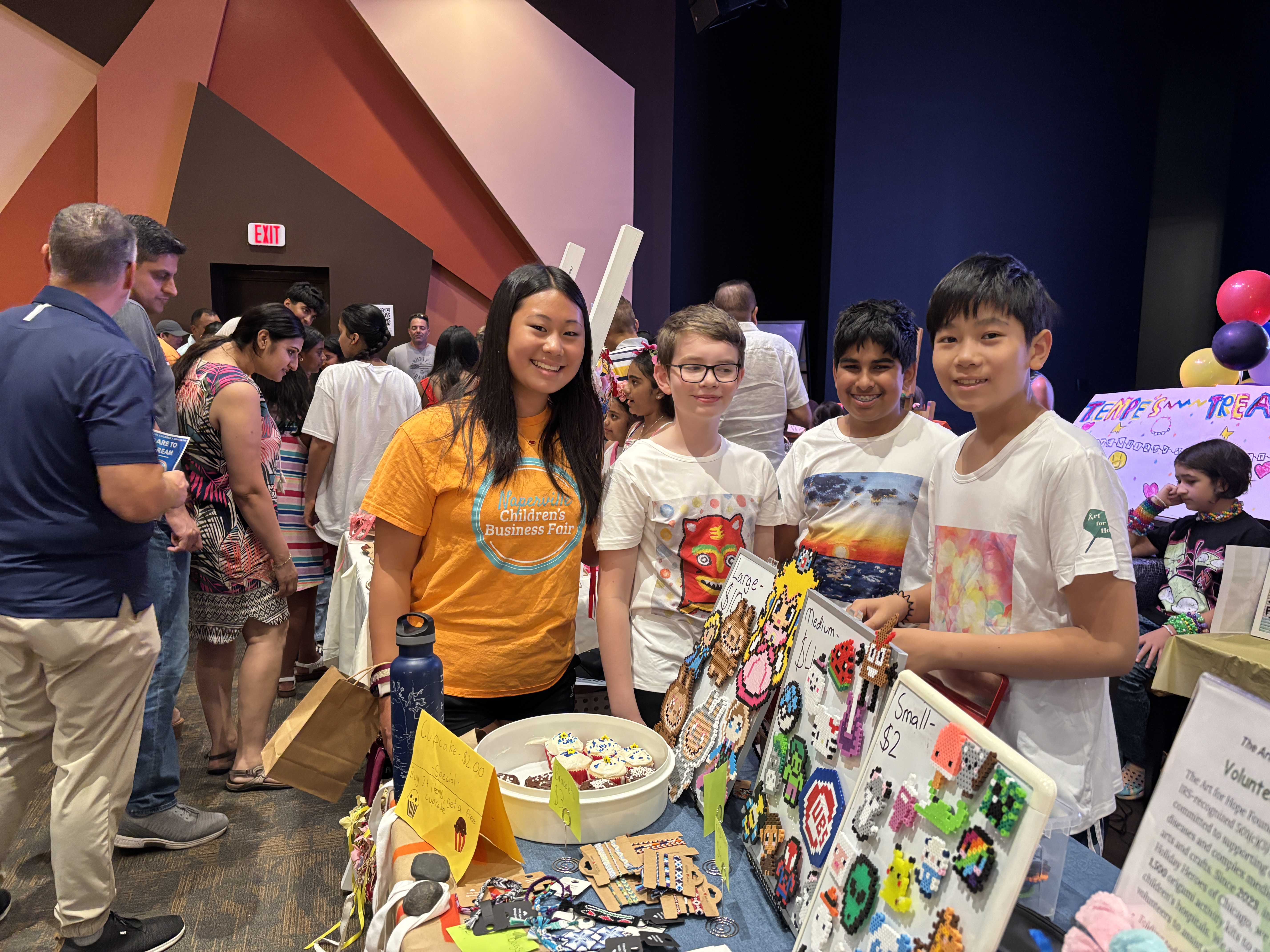 Young entrepreneurs presenting their businesses at the fair